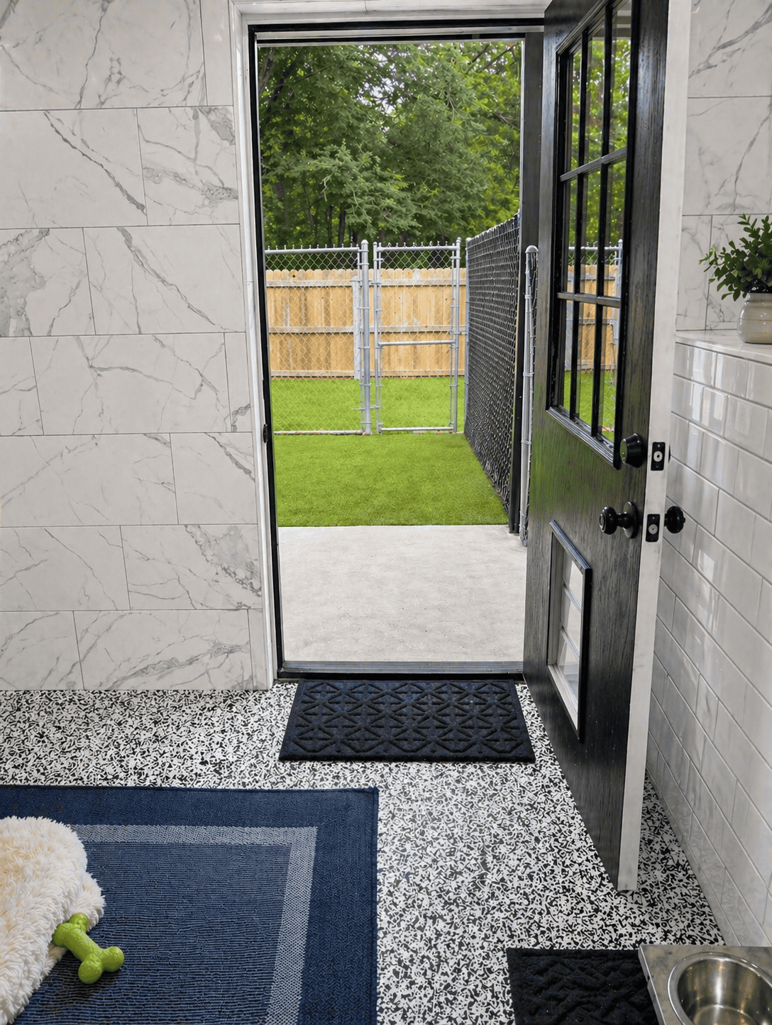Suite door opening to private outdoor run at Noble Nose Shreveport luxury kennel