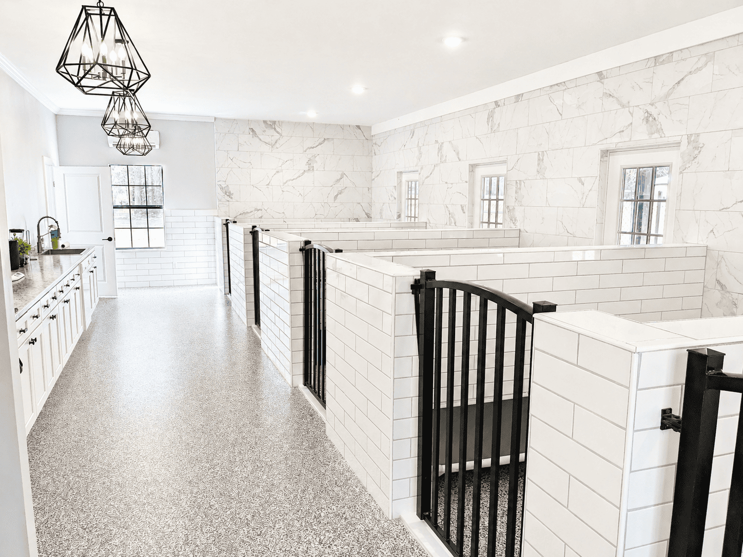 Luxury suite hallway with marble walls and chandeliers at Noble Nose Shreveport boarding